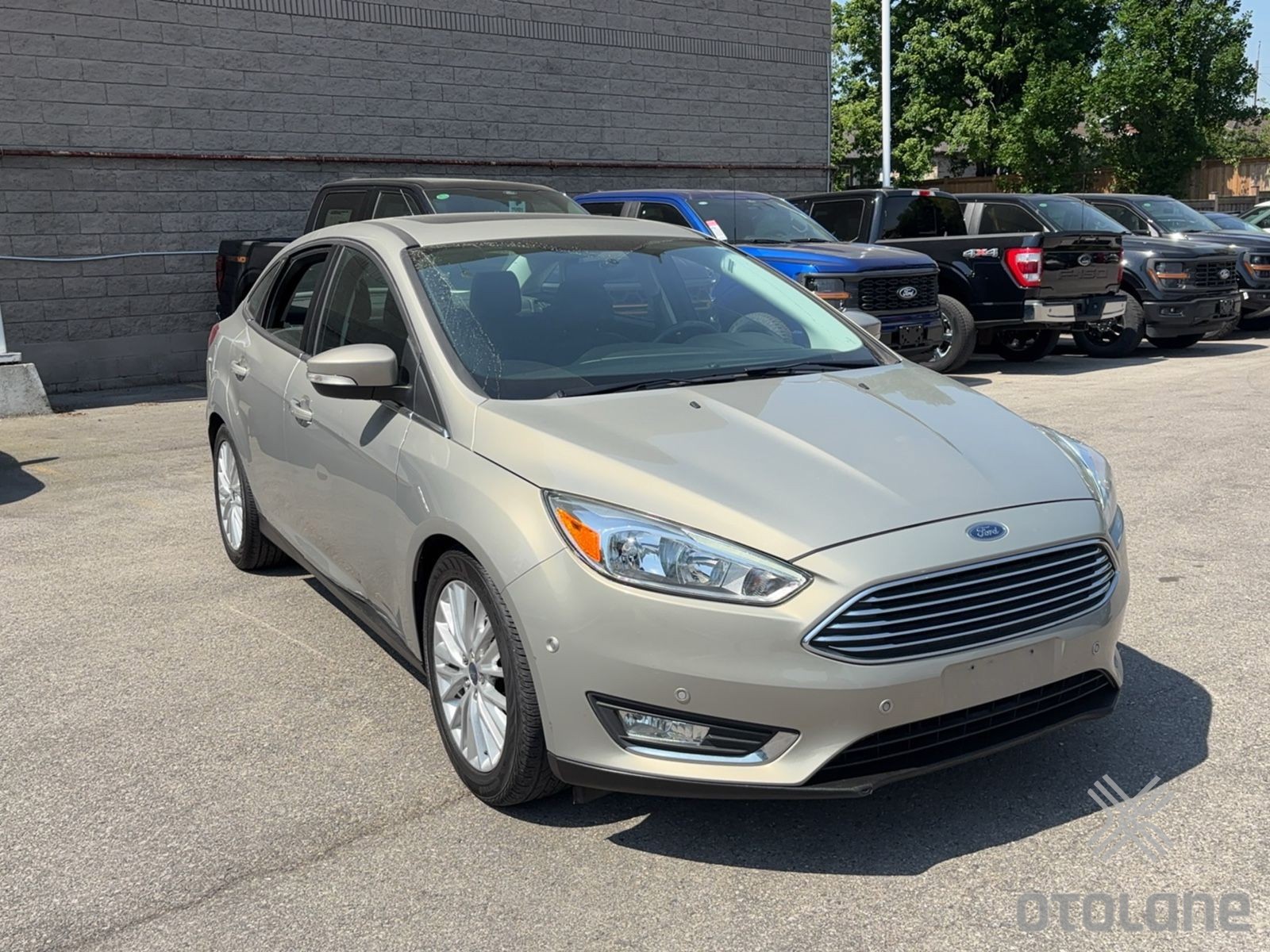 Gold 2016 Ford Focus Titanium Sedan Front-Wheel Drive Automatic
